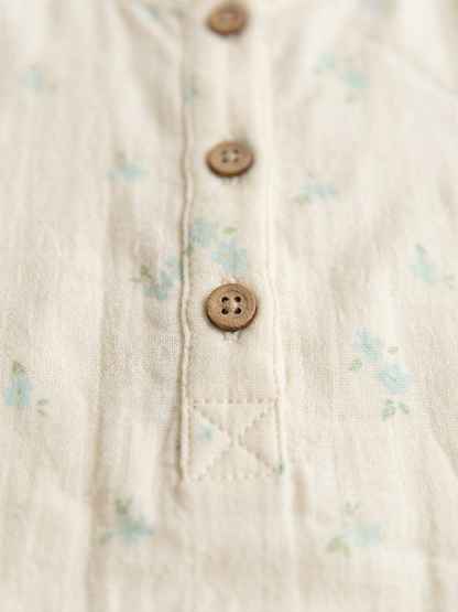 Girls’ Primrose Cream Muslin Bodysuit – Botanical Henley Romper with Wood-Grain Accents - Serromi