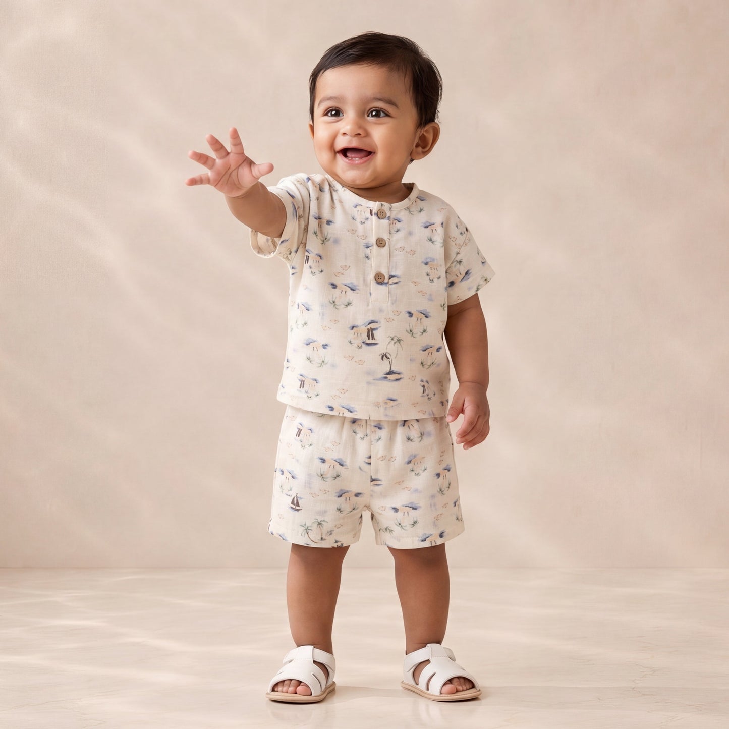Child wearing a patterned outfit on a plain background