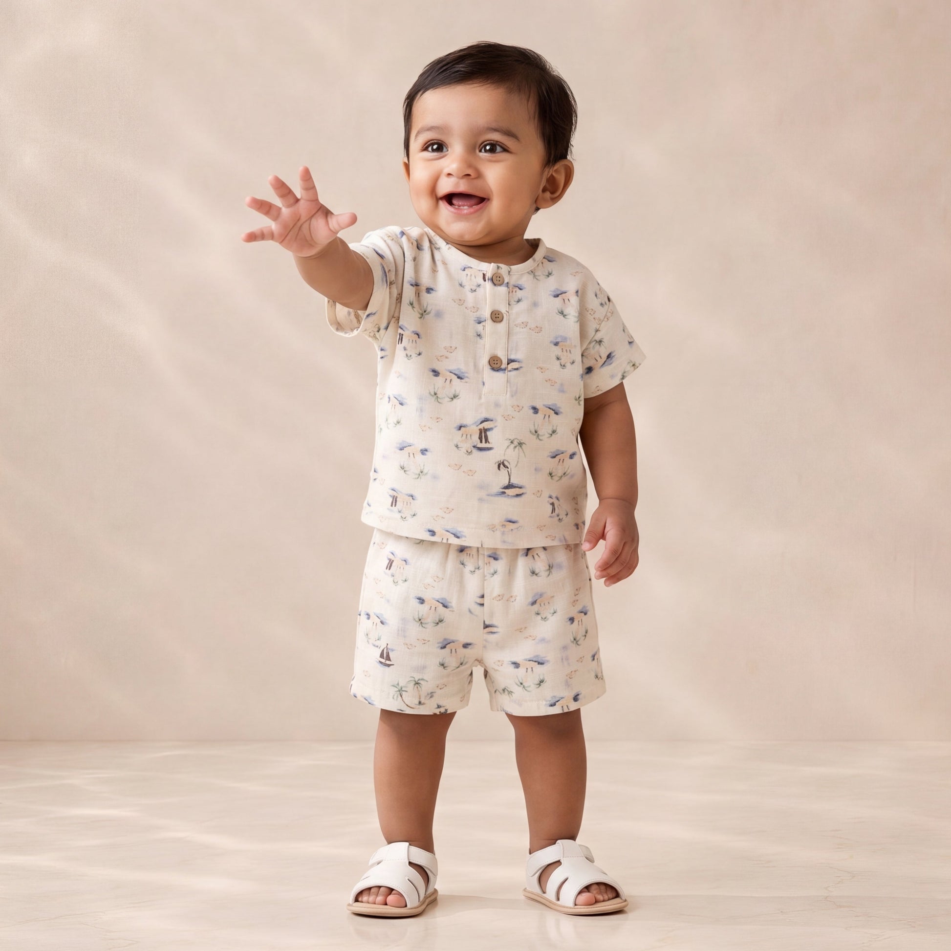 Child wearing a patterned outfit on a plain background