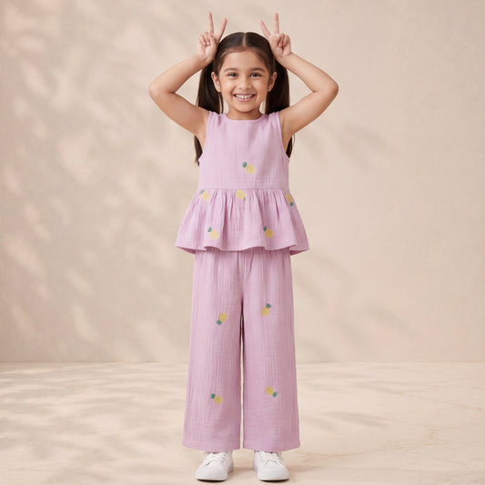 Young girl wearing a pink outfit with floral patterns on a beige background
